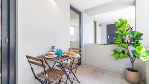 Enjoy a leisurely breakfast or evening drink on your delightful private balcony, providing a refreshing outdoor space to relax and soak in the ambiance. The ideal spot for savoring moments in the fresh air.
#PrivateBalcony #OutdoorDining #BalconyLife