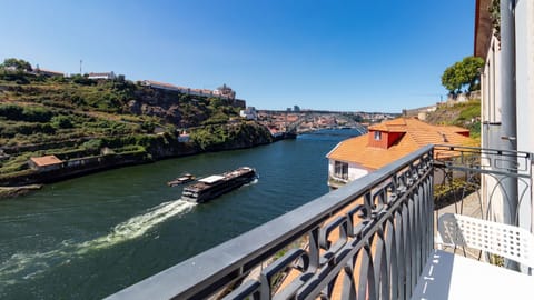 From your balcony, watch the lively activity on the Douro River as boats glide past, all set against a backdrop of historic Porto and its iconic architectural marvels. It’s an ever-changing spectacle that provides endless fascination and a true sense of p