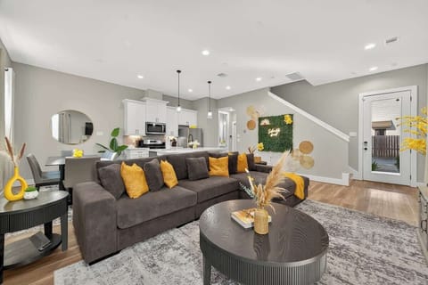 Living Room: Modern charm shines with vibrant accents and sleek design, perfect for gatherings!