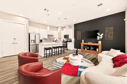 Modern, stylish open-concept living with a sleek kitchen, chic décor, and plenty of space to gather and unwind.