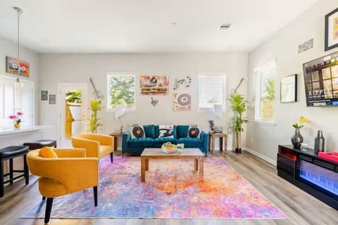 Living Room: Vibrant artwork and plush seating invite relaxation in this stylish retreat!