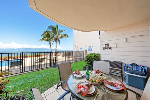 Poolside lanai with outdoor dining and ocean views just steps from the water.
