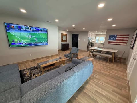 Comfy couches and a great 85 inch Smart TV. There is a sliding door behind the couch that leads to our extensive outdoor covered patio. Perfect for entertaining. 