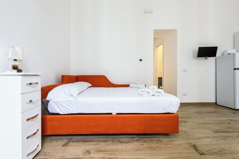 Apartment (0 Bedroom) | Laptop workspace, bed sheets