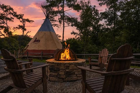 Cozy private outdoor fire pit area perfect for relaxing at dusk.
