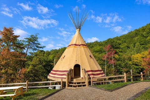 Luxury Smoky Mountain glamping tepee nestled inside gated Parkside Resort, offering a unique mountain retreat just minutes from Dollywood, Pigeon Forge Parkway, and top Smoky Mountain attractions.