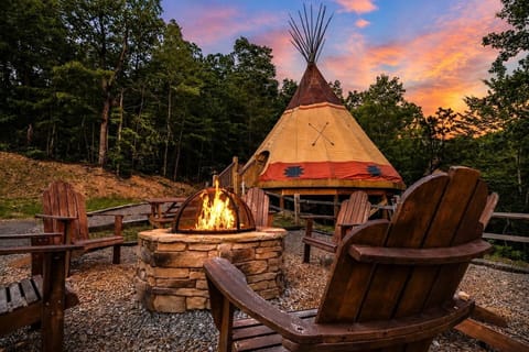Cozy outdoor fireplace creating the perfect setting for relaxing evenings, romantic mountain escapes, and memorable Smoky Mountain getaways year round