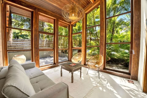 Deluxe Quadruple Room, Lanai, Garden View | Living area | Smart TV