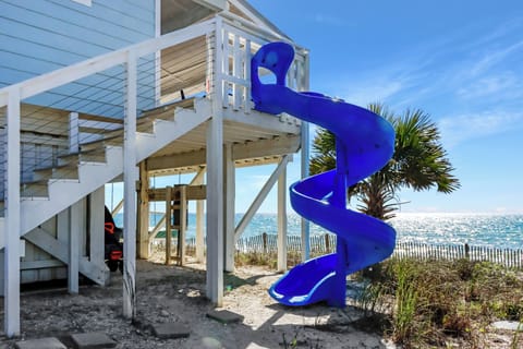 Welcome to Antilles Beach Cottage - take the slide down to the beach!