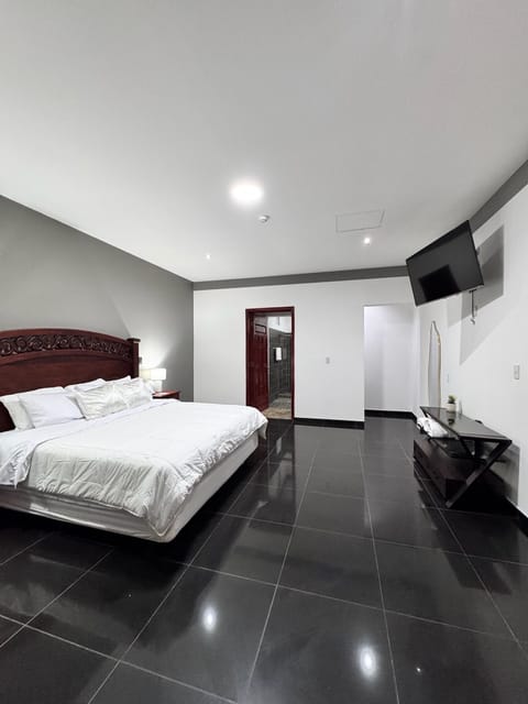 Deluxe Suite, Balcony, City View | Iron/ironing board, WiFi (free), bed sheets