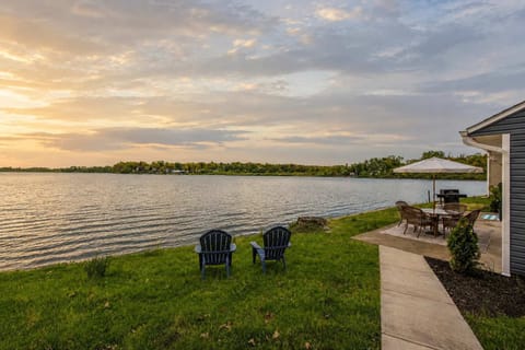 Waterfront lawn w/ Adirondack chairs, perfect for soaking in peaceful lake views