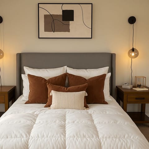 King bedroom with warm accents and natural light
