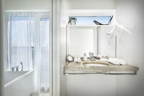 Luxury Suite, Sauna, Sea View | Bathroom | Combined shower/tub, free toiletries, hair dryer, bathrobes