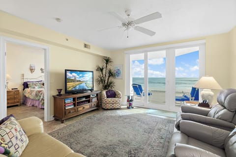 Living room with view of the Ocean and master bedroom to the left.