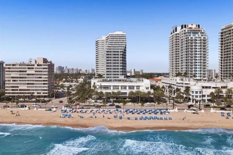 Panoramic view of Fort Lauderdale Beach coastline with turquoise waters and walkable beachfront lifestyle.