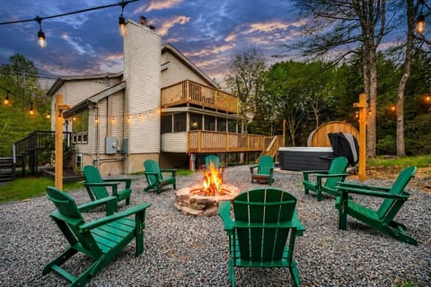 This is where the evenings begin — fire pit, hot tub & sauna, just steps from the sunset.
