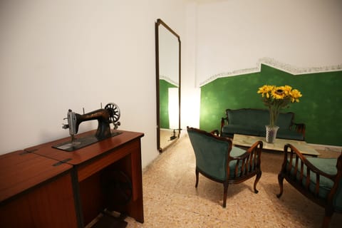 Triple Room, Balcony | Living area | Flat-screen TV