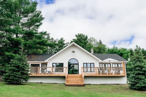 Spacious deck and large windows invite nature inside