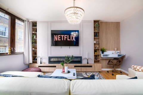 Private living room (sits up to 7 people) with electric fireplace and 50inch Smart TV