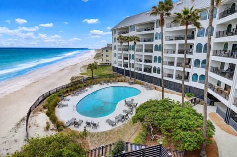 Oceanfront condo with resort-style pool and direct beach access.