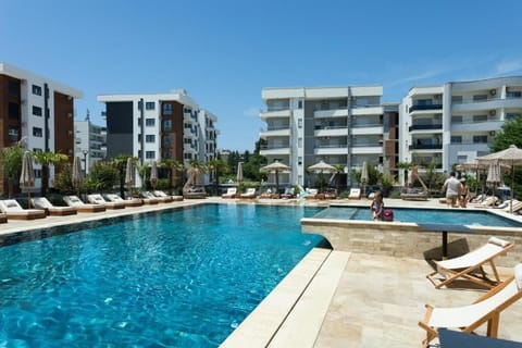 Seasonal outdoor pool, pool umbrellas, sun loungers