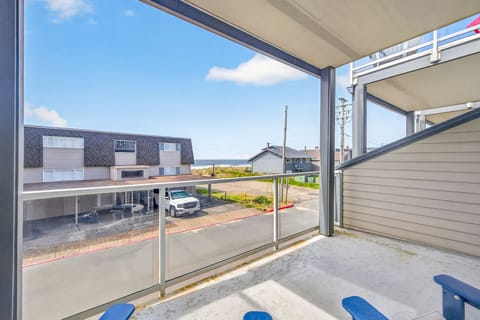 Step onto your private balcony and breathe in the fresh coastal air while enjoying views of the neighborhood and ocean beyond.