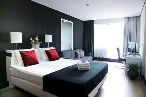 Unwind in crisp linens and a bright, airy room.