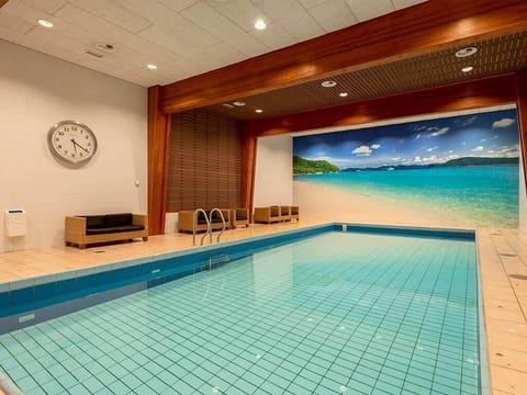 Unwind with a refreshing swim in the serene indoor pool.