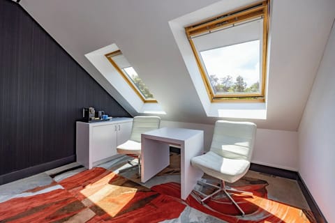 Sip morning coffee beneath skylights in a bright workspace nook.