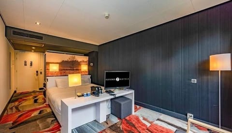Settle in comfortably with a cozy bed and in-room essentials.