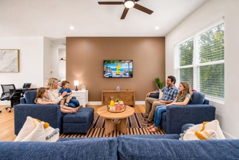 Beach day ends here: big screen, deep couch, room for everyone!