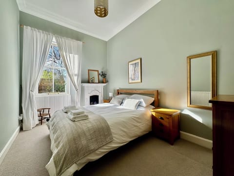 Beautiful peaceful bedroom facing garden.