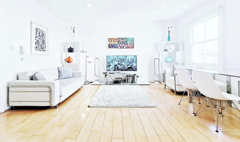Large bright living with real wood Canadian maple floor