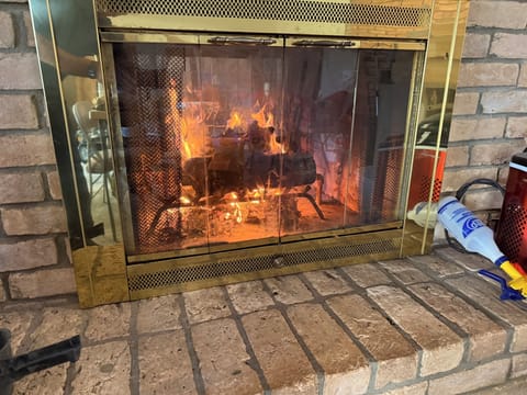 Wood Burning Fireplace opens to both living areas