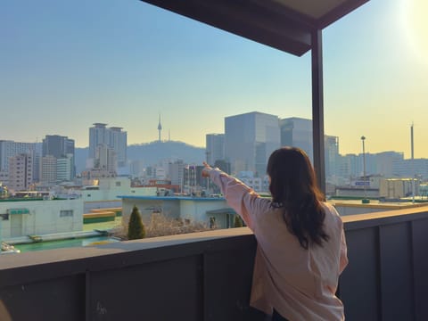 Family Quadruple Room, Balcony, City View | Property grounds