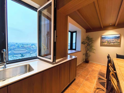 Luxury Suite, City View | Private kitchen | Electric kettle, cleaning supplies, paper towels