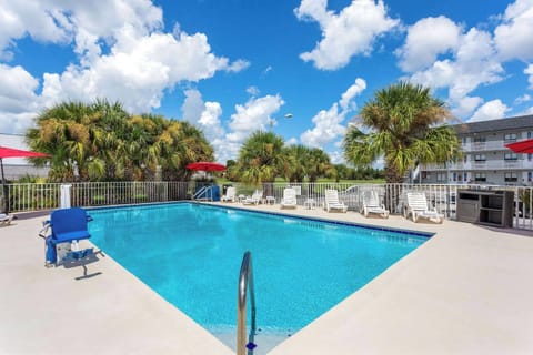 Dive into sparkling water and lounge under sunny palms.