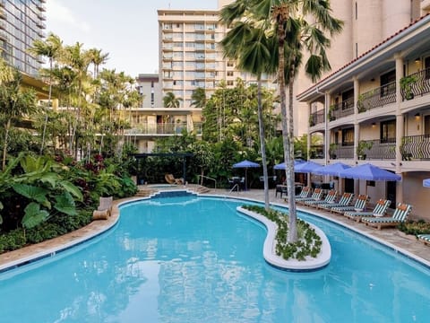 Float peacefully through a tropical courtyard pool escape
