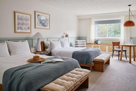 Settle into crisp beds in a serene, sunlit retreat.