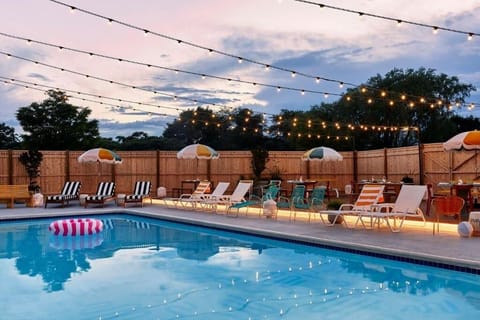 Unwind under twinkling lights with a refreshing evening swim.