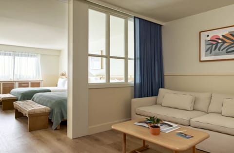Unwind in a roomy suite with separate sleep and lounge zones.