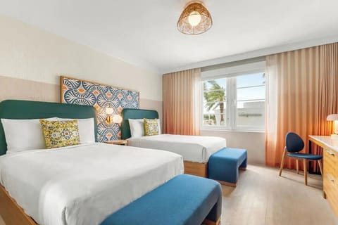 Unwind in bright, airy beds with sunny window views.