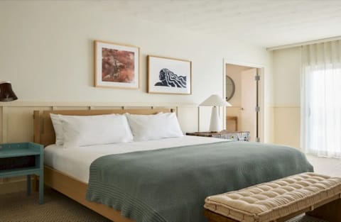 Unwind in crisp linens and a calm, sunlit bedroom.