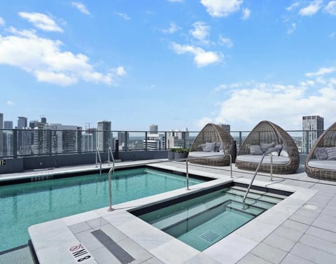 Take in panoramic city views from the pool!