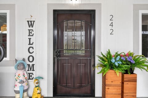 Charming front porch with welcoming decor and vibrant blooms