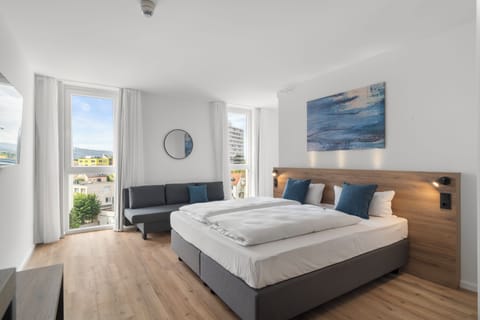 Superior Double Room | Minibar (free items), desk, laptop workspace, blackout drapes