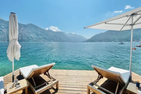 Orahovac Beach in Kotor Bay: clean pebbles, turquoise water, cozy atmosphere. Aw