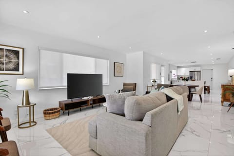 Curl up in the chic living room & stream your favorites on the smart TV​