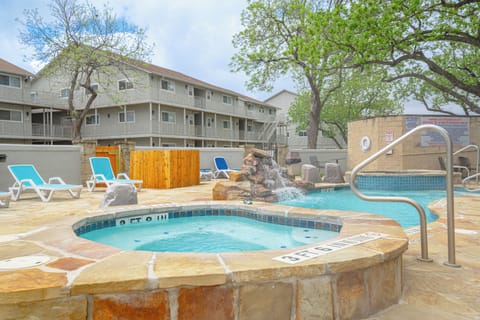 Heated poolside hot tub & lounge deck at Waterwheel — steps from condo K102