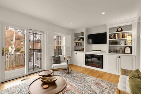 Living room with electric fireplace & smart TV